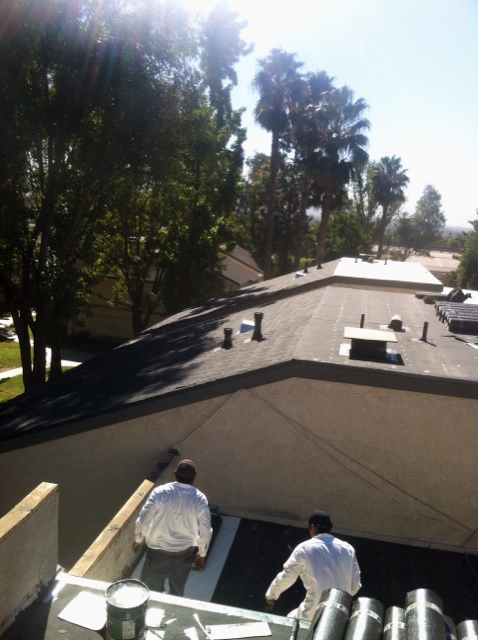 Contractors Repairing Apartment Roofing